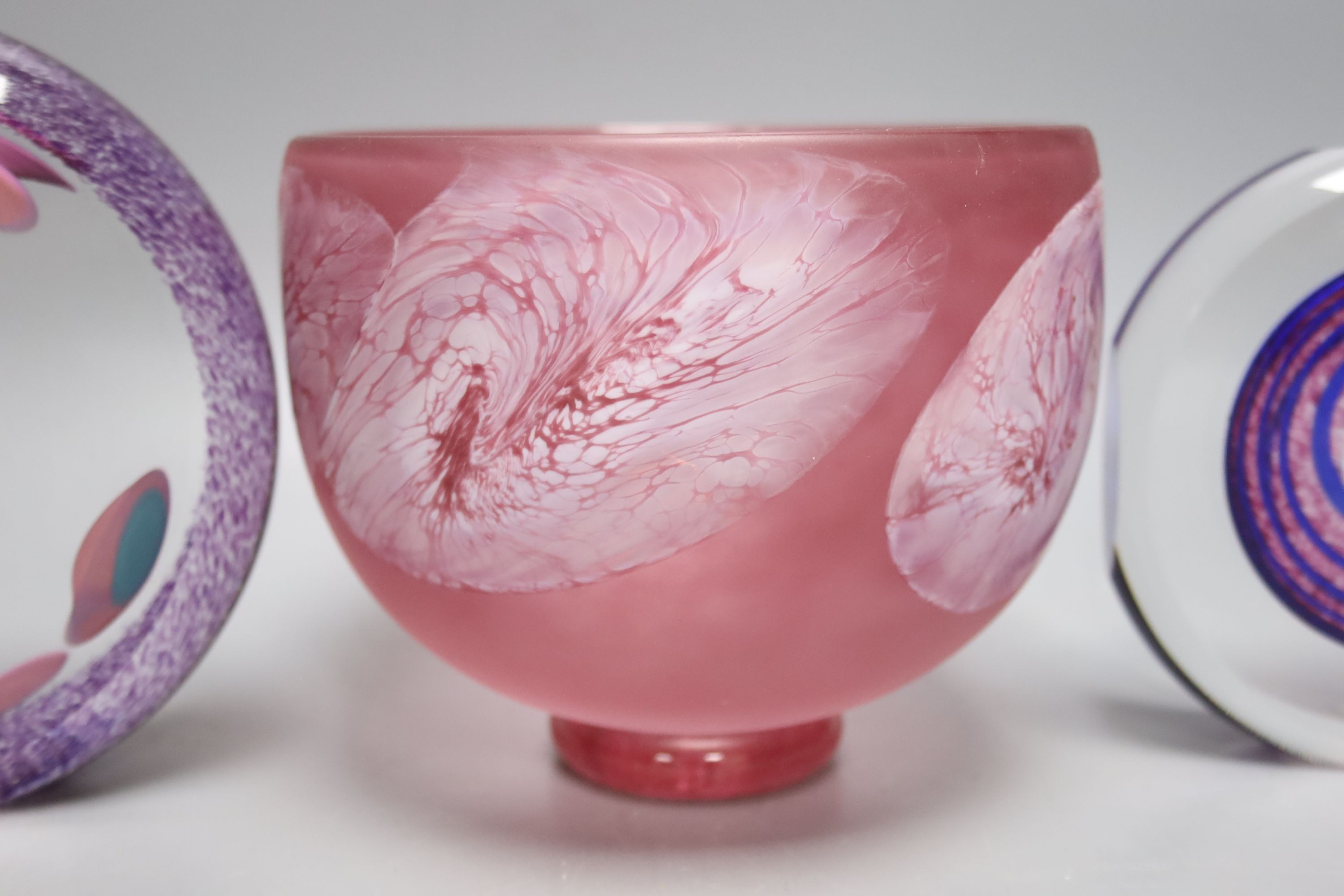 Two Jane Charles art glass disc panels and a pink art glass bowl, tallest 15.5cm